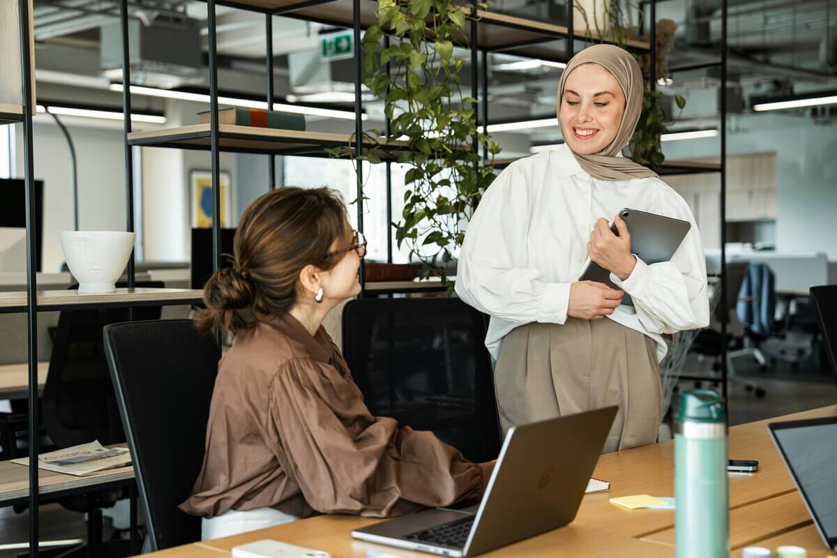 Two women chatting abut the importance of soft skills in IT