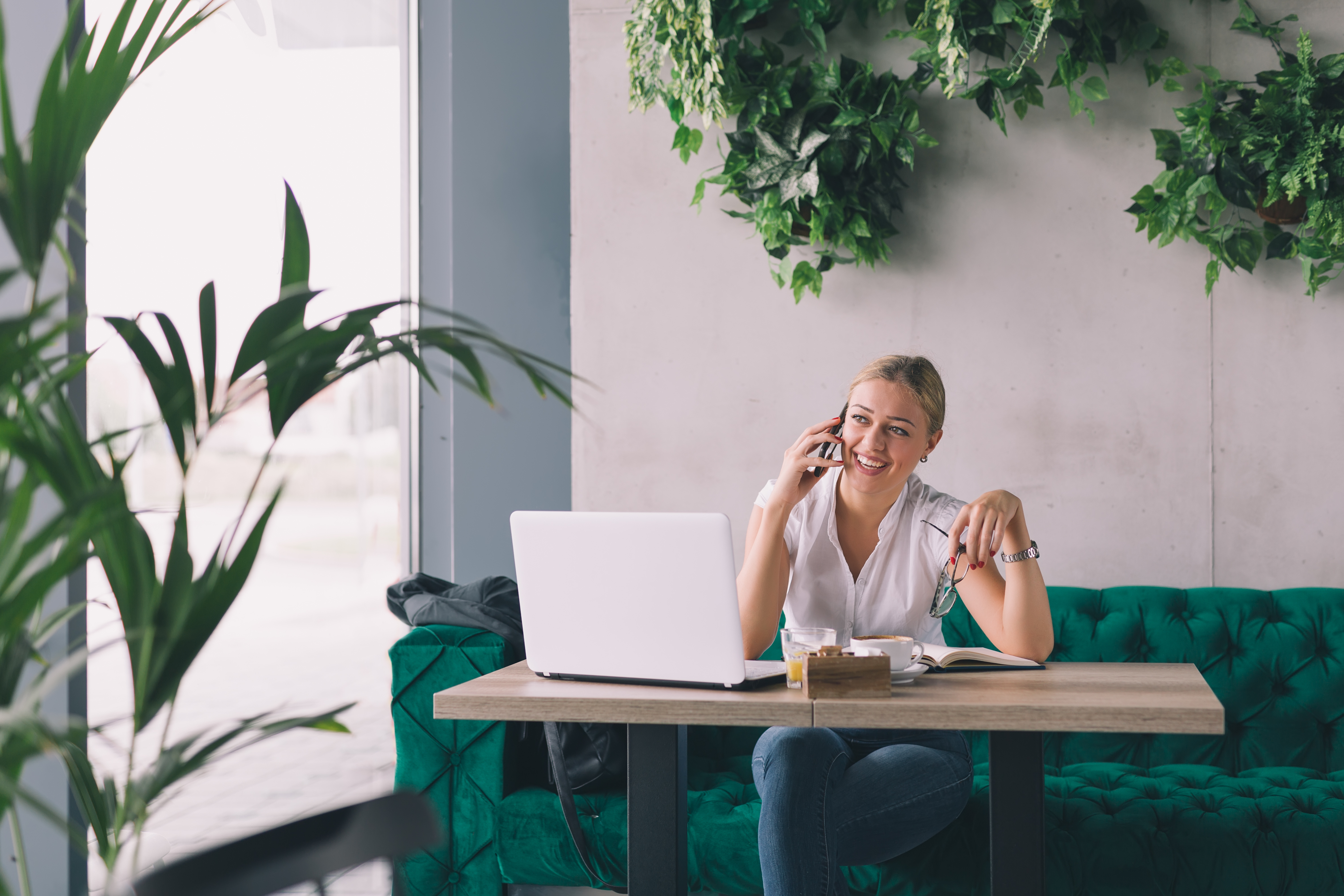 Young aspiring niche accountant on the phone discussing new roles